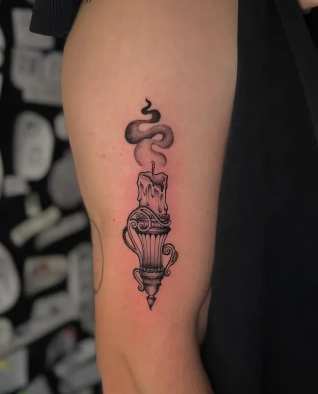 Candle with rising smoke in black and grey